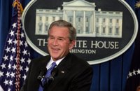 President George W. Bush smiles as he listens to reporter's question Thursday, Jan. 26, 2006, during a press conference at the White House that covered several topics including economy, the upcoming election year and fiscal policy. White House photo by Kimberlee Hewitt.
