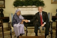 President George W. Bush welcomes Liberia's President Ellen Johnson Sirleaf to the Oval Office at the White House, Tuesday, March 21, 2006. President Sirleaf is the first woman elected President to any country on the continent of Africa. White House photo by Eric Draper.