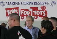 President George W. Bush meets with U.S. Marines working Monday, Dec. 19, 2005 at the 'Toys for Tots' collection center at the Naval District Washington Anacostia Annex in Washington, D.C. White House photo by Kimberlee Hewitt.