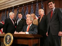 President George W. Bush is joined by members of Congress as he signs H.R. 1053, to authorize the Extension of Nondiscriminatory Treatment to the Products of Ukraine, Thursday, March 23, 2006, in the Eisenhower Executive Office Building in Washington. President Bush is joined by, from left to right, U.S. Sen. Richard Lugar, R- Ind.; U.S. Rep. Jim Gerlach, R-Pa.; U.S. Rep. Tom Lantos, D-Calif.; U.S. Rep. Candice Miller, R-Mich; U.S. Rep. Curt Weldon, R-Pa., and U.S. Rep. Mike Fitzpatrick, R-Pa. White House photo by Kimberlee Hewitt.
