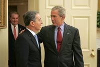President George W. Bush welcomes Colombian President Alvaro Uribe to the Oval Office Wednesday, June 14, 2006. White House photo by Paul Morse.