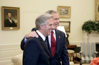 President George W. Bush and President Tabare Vazquez of Uruguay talk with the press in the Oval Office Thursday, May 4, 2006. White House photo by Eric Draper.