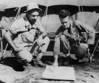 Lt. Col. Henry A. Mucci (left), commander of the 6th Ranger Battalion, confers with his personnel officer, Capt. Vaughn Moss. Mucci led the Jan. 30, 1945 raid on the Cabanatuan POW camp featured in the film which opens Aug. 12.