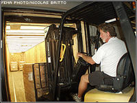 FEMA employee loads supplies in a FEMA trailer in anticipation of the possible arrival of Hurricane Katrina. Nicolas Britto/FEMA
