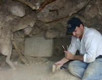 Marcello Canuto with hieroglyph panel from Site Q - La Corona, Guatemala Click here for a high resolution photograph.