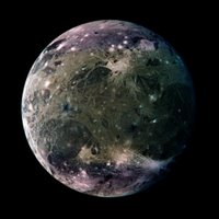 In this global view of Ganymede's trailing side, the colors are enhanced to emphasize color differences.