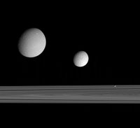 grouping of three moons -- Dione, Tethys and Pandora -- near the rings provides a sampling of the diversity of worlds that exists in Saturn's realm.