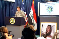 Army Maj. Gen. William B. Caldwell briefs reporters in Baghdad, June 8, 2006, on the June 7 air strike that killed terrorist Abu Musab al Zarqawi. U.S. military officials released the photo to Caldwell's right of the deceased Zarqawi . U.S. Army photo.