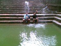 The magic of water, trapped in this image. My best friend Ajju (Ajit Patil)(L) and my brother Amit (R) sitting beside the “Brahma Kund”.