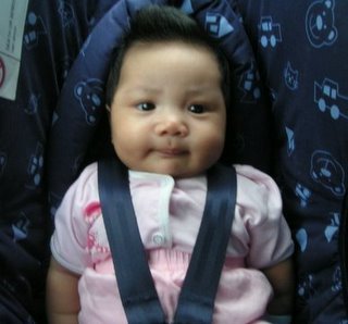 A'isyah in her babyseat