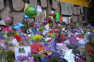 Flowers, balloons, messages and khaki shirts outside Australia Zoo