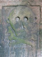 Pictish stone with skull and cross bones