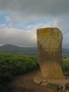 Pictish sybol stone with Tap O' Noth hill in the background