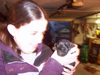 Aunt Laura holding the black puppy