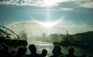 Fireboats spraying water in Genoa harbor