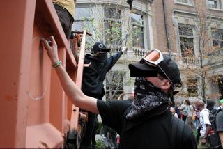 Protester defacing truck