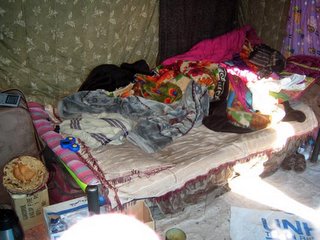 The interior of a tent in a typical survivor village.