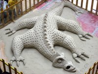 Sand sculpture of a dragon.