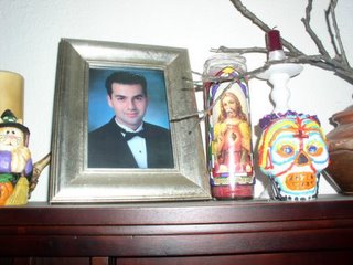 My brother's altar, with candle and Sugar Skull