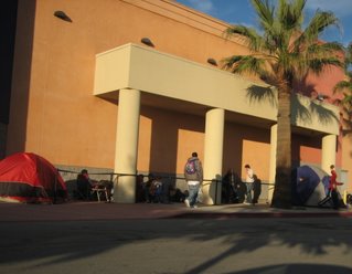 Shoppers line up outside a Best Buy store in Palo Alto on Wednesday.