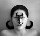 black and white photo of Marina wearing a scorpion on her nose