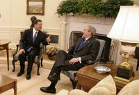 President George W. Bush meets with President Leonel Fernandez of the Dominican Republic in the Oval Office Wednesday, Oct. 25, 2006. White House photo by Eric Draper.