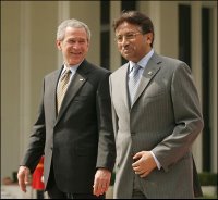 President George W. Bush and Pakistan President Pervez Musharraf walk together to their joint news conference at Aiwan-e-Sadr in Islamabad, Pakistan, Saturday, March 4, 2006.