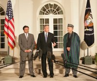 President George W. Bush stands with President Pervez Musharraf of the Islamic Republic of Pakistan, left, and President Hamid Karzai of the Islamic Republic of Afghanistan, Wednesday evening, Sept. 27, 2006, in the Rose Garden at the White House speaking to reporters prior to the three leaders attending a private dinner. White House photo by David Bohrer.