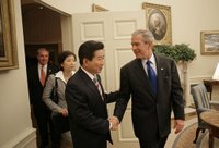 President George W. Bush welcomes President Roh Moo-hyun of South Korea to the Oval Office Thursday, Sept. 14, 2006. White House photo by Eric Draper.
