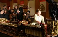 President George W. Bush and Laura Bush create their own music after a traditional gamelan musical performance Thursday, Nov. 16, 2006, at the Asian Civilisations Museum in Singapore. The Bushes are scheduled to depart Singapore on Friday for Vietnam and the 2006 APEC Summit. White House photo by Paul Morse.