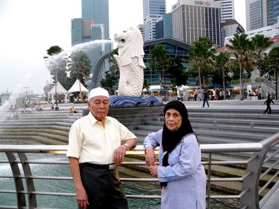 Mom & Dad with Merlion At Fullerton One