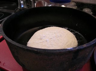 The dough in the dutch oven ready to rise for 2 hours.