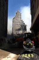 A New York City firefighter looks up at what remains of the World Trade Center Sept. 13, 2001, after its collapse following the Sept. 11 terrorist attack. Photo by Photographer's Mate 2nd Class Jim Watson, USN