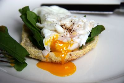 photograph picture of a homemade English muffin with a poached egg and sorrel recipe.