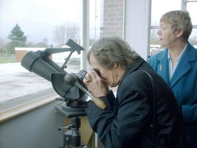 elaine looking through a smaller telescope
