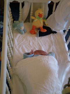 Home, sleeping in my cot