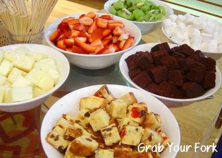 fruits, cake squares and marshmallows for chocolate dipping