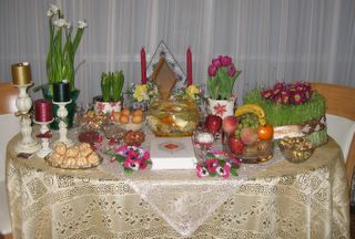 our HaftSin table [1.Seeb (Apple), 2.Sabze (green grass), 3.Serke (vinager), 4.Senjed (a type of berry), 5.Sekke (coin), 6.Seer (garlic), 7.Somagh (Sumac berry)]