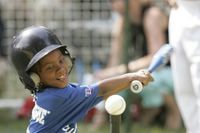 Shaquana Smith of the Jackie Robinson South Ward Little League Black Yankees of Newark, N.J., swings at the ball Sunday, June 26, 2005, during 