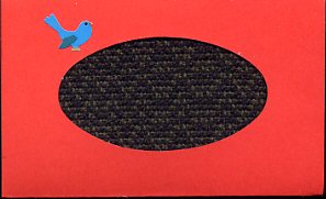Red card with handwoven black & green shadow weave inset & bluebird sticker.