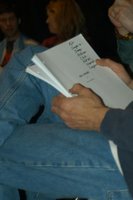 An actress on stage sits with a copy of the Soul Catcher script in her lap