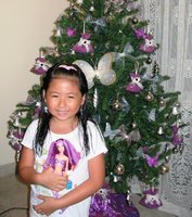 Dylea clutching her barbie doll