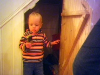 Playing hide and seek under the stairs