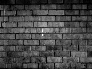 Exclamation mark on a Brick Wall