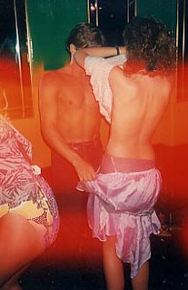 A couple swapping clothes in a nightclub in Benidorm, Spain