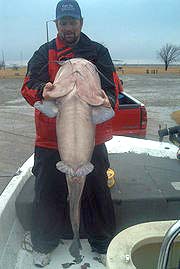 Fishing Guide David Clark and his 82 lb monster catfish at Lake Sooner Oklahoma