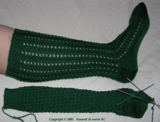 One and a half hand knit green knee socks
