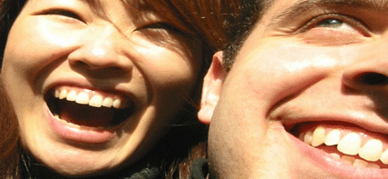 Two People smile and show their teeth