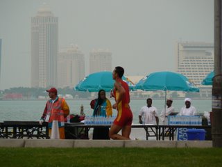 A runner passes by, with the Sheraton hotel in the background