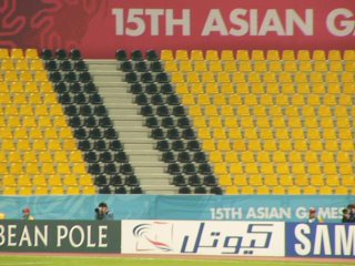 Korean cheering and singing fill the stadium - but where is the sound coming from?